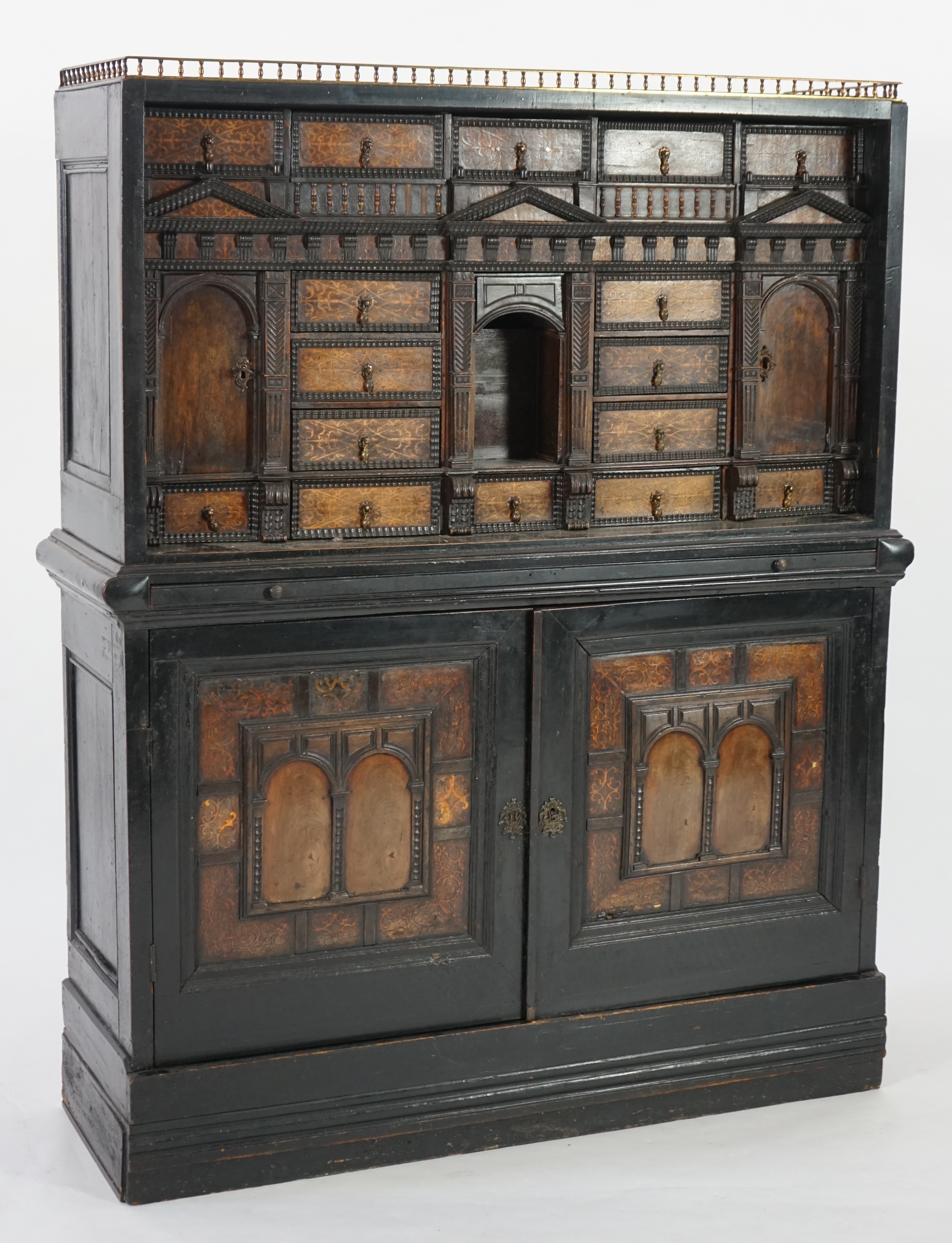 An 18th century and later Dutch walnut ebonised and marquetry inlaid collector's cabinet on stand